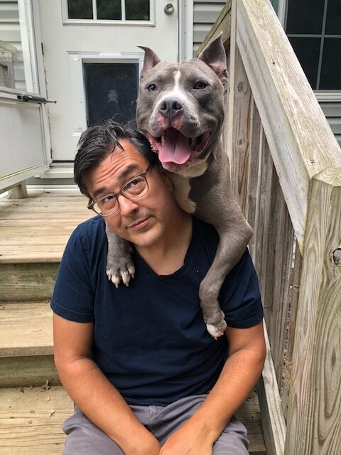 dog and volunteer cuddle