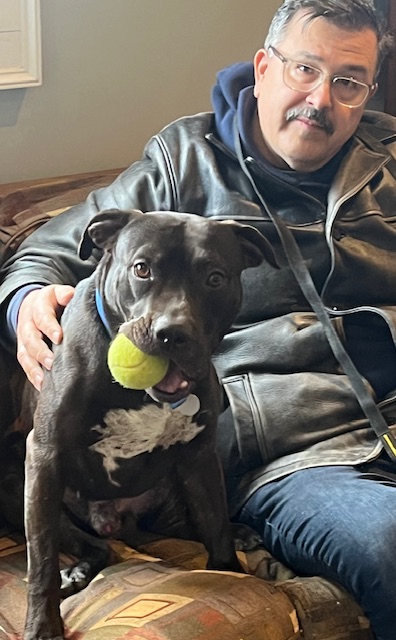 man and dog with tennis ball